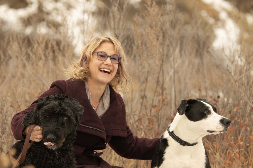 Heather Shenton smiling with her two dogs